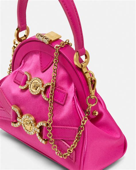 versace borsa in pelliccia|Borsa a secchiello con cristalli La Medusa .